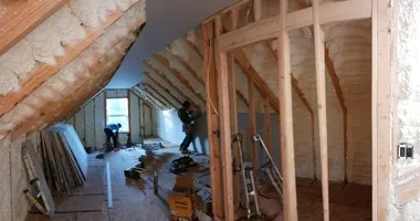 Professional drywall sheets being installed in a new construction project.